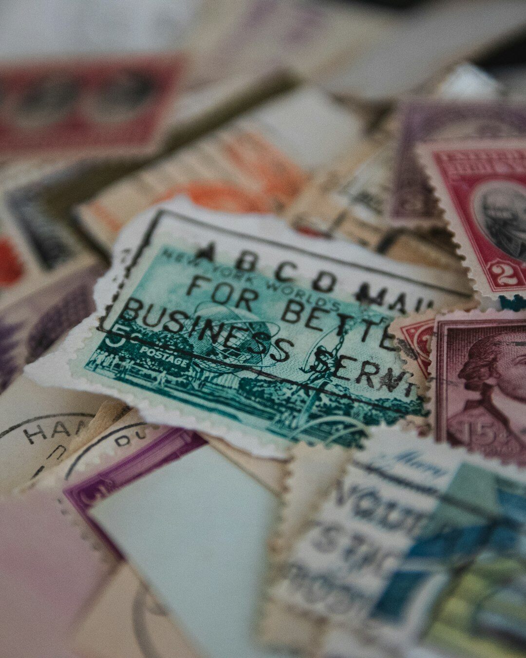 person sorting old stamps