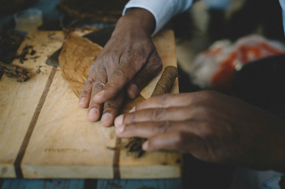 elderly person carving wood
